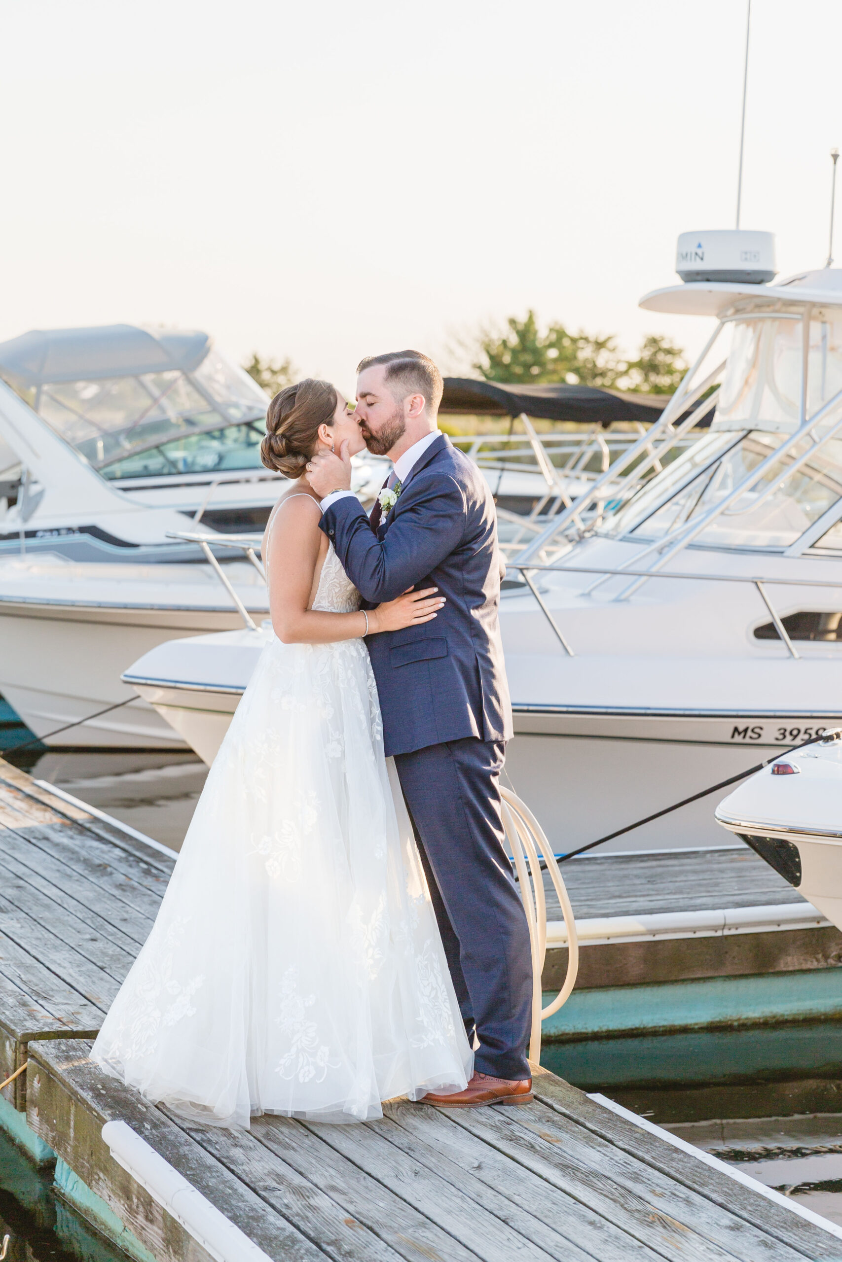 Couple kissing at their nautical cape cod wedding
