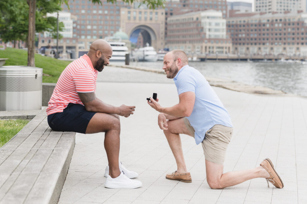 A man proposing at Fan Pier Park in Boston, Massachusetts.