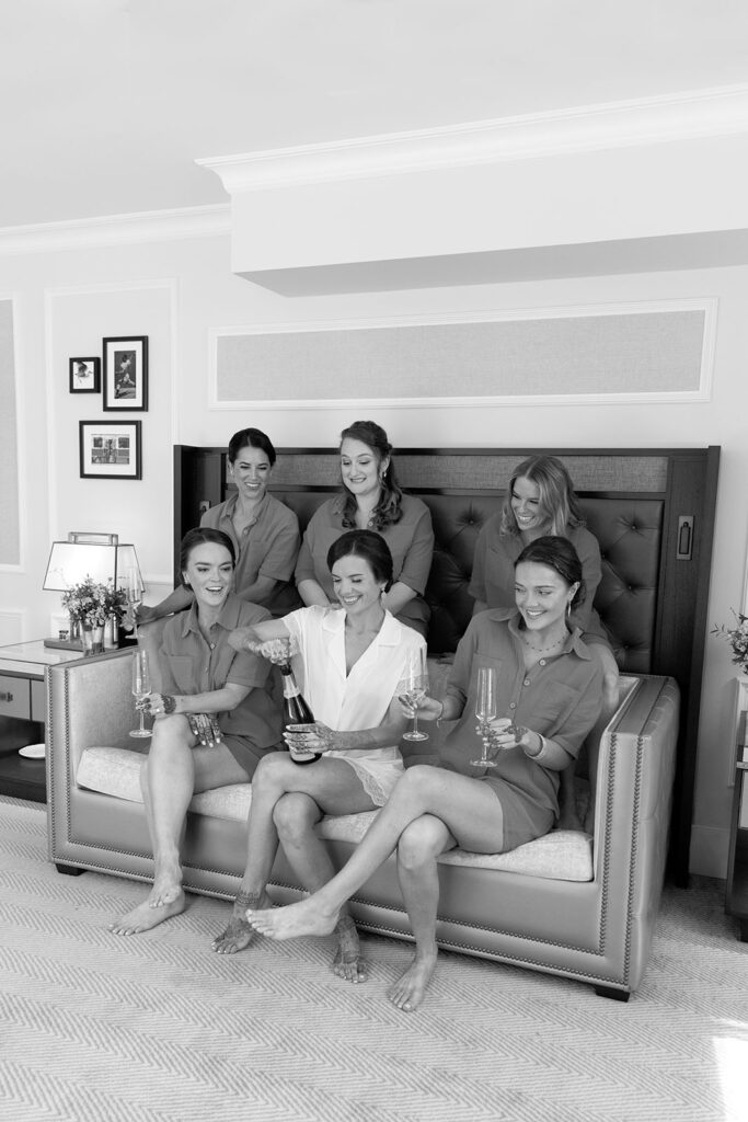 Bride gets ready with her bridesmaids at the Langham Hotel in Boston.