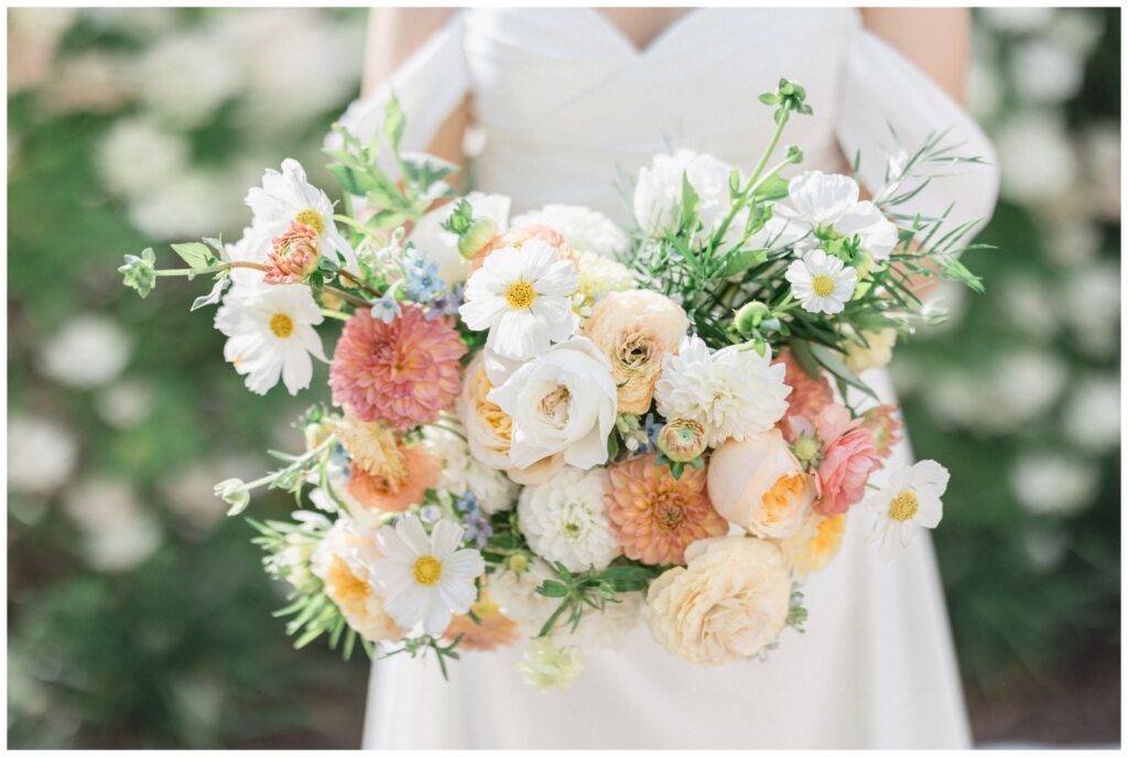 Bridal bouquet with cosmos, garden roses, and dahlias.